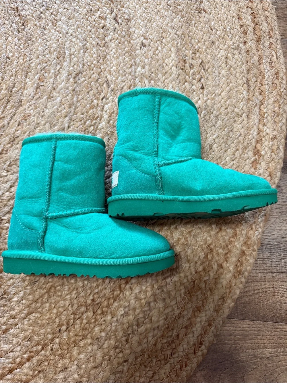 UGG Kids' Classic Short II boots in a  emerald green genuine shearling lining.
